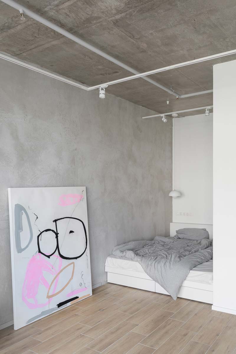 open slaapkamer betonlook muren