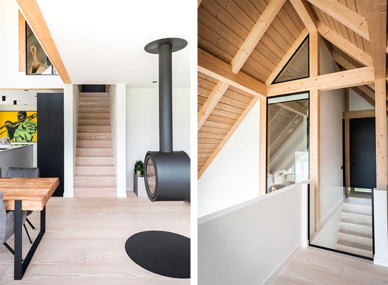 En zo ziet het modern landelijke interieur eruit, met onder andere een hangende haard, houten trap en strakke witte muren. | Bron: Finnhouse.nl