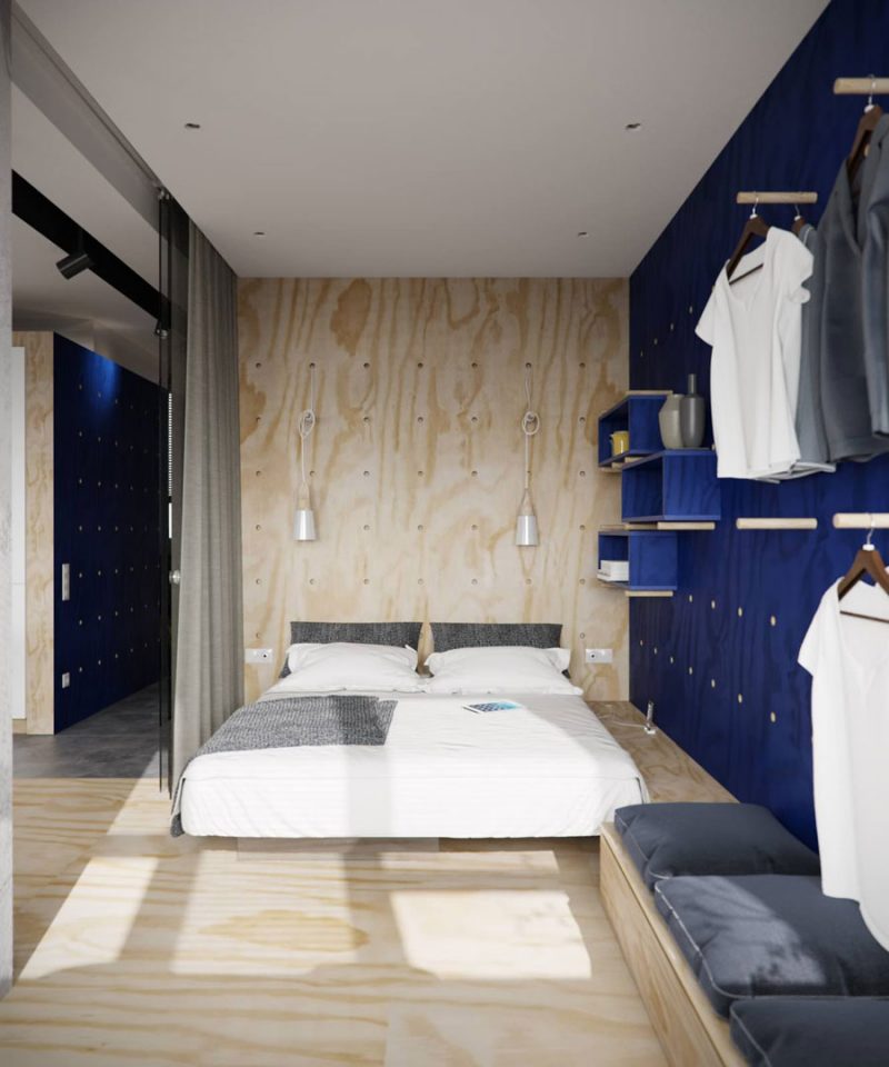 Stoere slaapkamer met een blauwe gaatjesbord muur