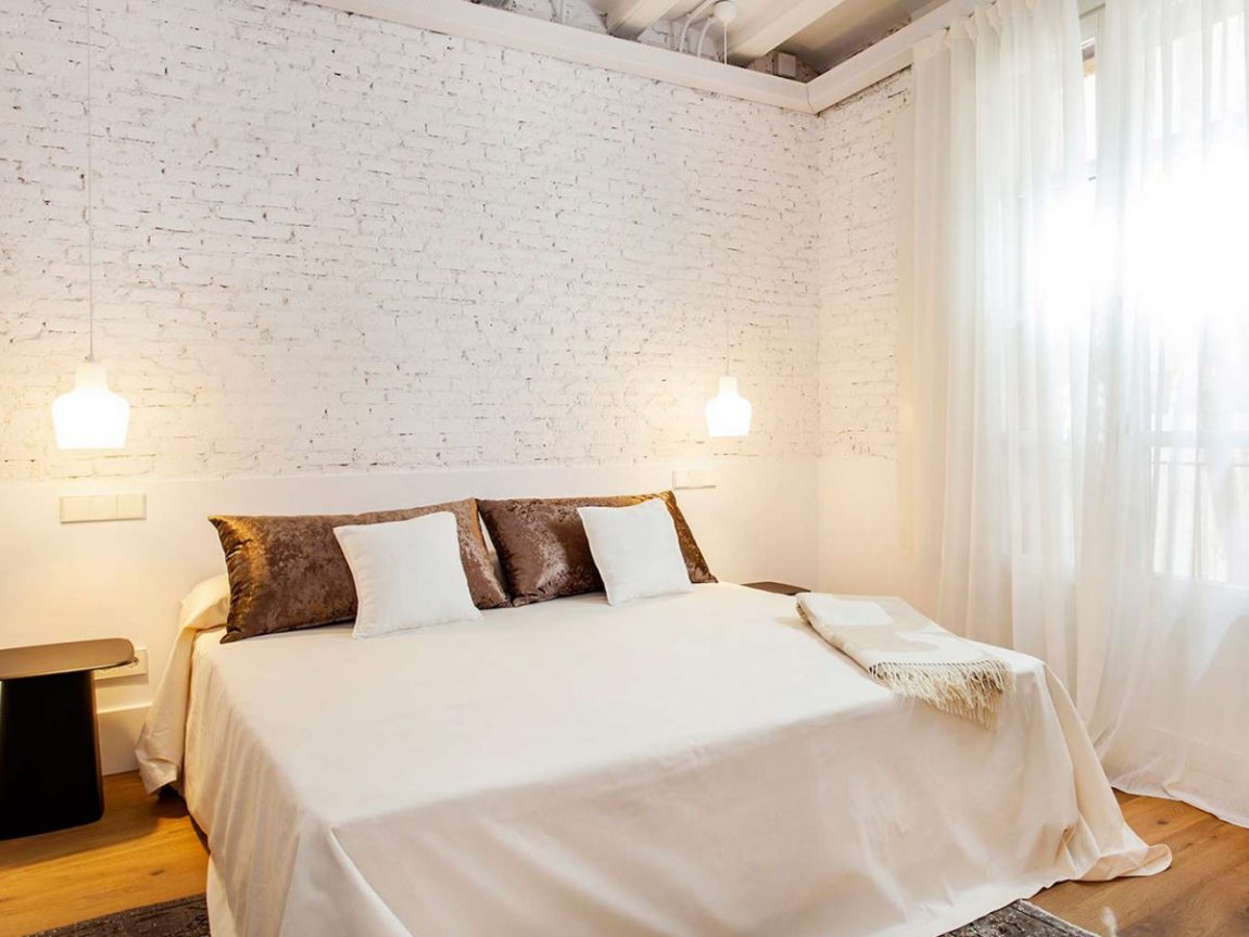 witte-bakstenen-muur-slaapkamer